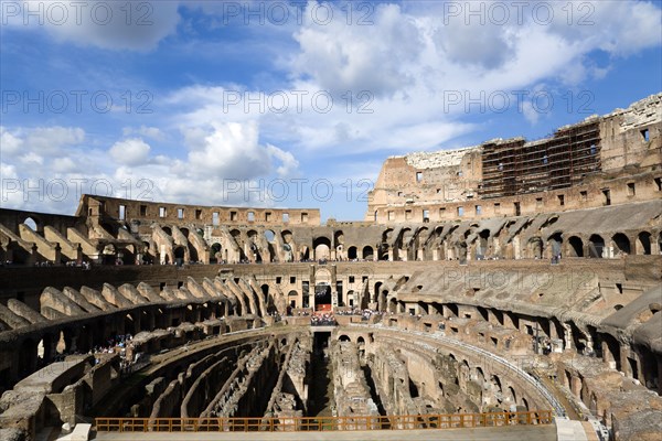 ITALY, Lazio, Rome, The interior of the Colosseum with viewing tourists