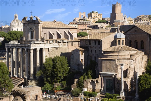 ITALY, Lazio, Rome, The Forum with the Temple of Antoninus and Faustina on the left and the domed Temple of Romulus on the right