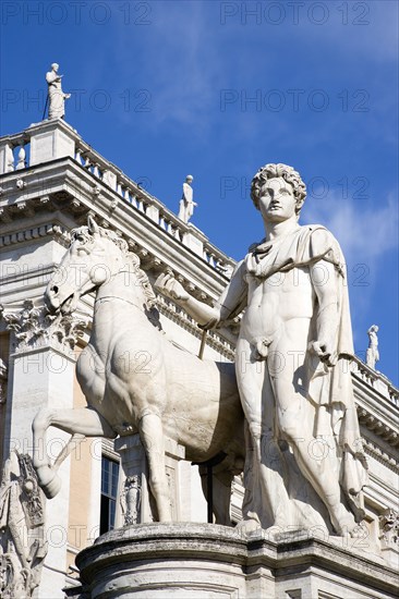 ITALY, Lazio, Rome, One of the statues of the Dioscuri Castor and Pollux at the top of the Cordonata on the Capitol in front of Palazzo Nuovo