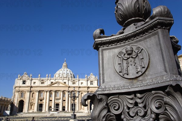 ITALY, Lazio, Rome, Vatican City The Basilica of St Peter and a detail of a lamppost in the square with the Papal Keys on it