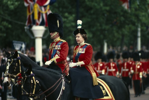 ENGLAND, London, The Queen and The Duke of Edinburgh on horseback returning from Trooping the Colour