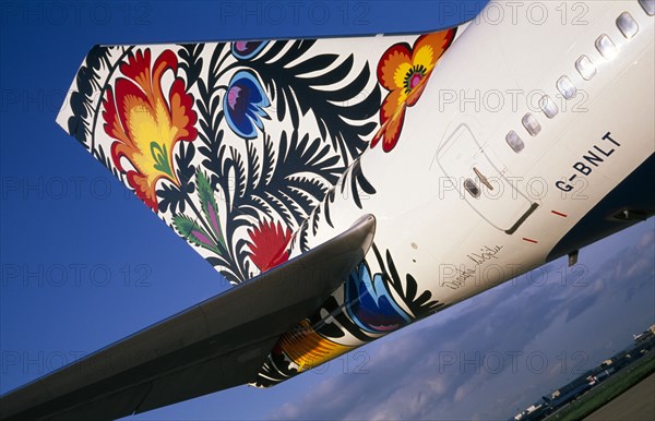 TRANSPORT, Air, Plane Detail, Boeing 747-400 at Gatwick Airport operated by British Airways. Detail of tail design by artist Danuta Wojda from Poland entitled Cockerel of Lowicz