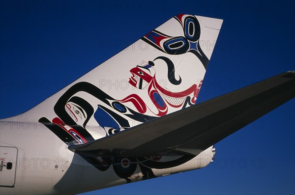 TRANSPORT, Air, Plane Detail, Boeing 747-400 at Gatwick Airport operated by British Airways. Detail of tail design by artist Joe David from Canada entitled Whale Rider