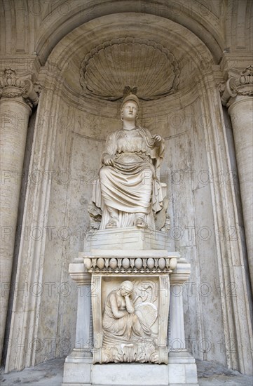 ITALY, Lazio, Rome, Colossal Statue of Sitting Rome Cesi Roma in a niche within the courtyard of the Palazzo dei Conservatori on the Capitol. The marble statue of a seated woman dates from the Hadrian period of 117-138 BC