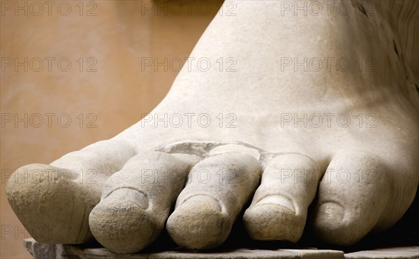 ITALY, Lazio, Rome, The courtyard of the Palazzo dei Conservatori part of the Capitoline Museum with a marble foot from one of the many colossal statues of ancient Rome