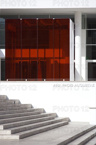 ITALY, Lazio, Rome, The steps leading to the building hosuing the Ara Pacis or Altar of Peace built by Emperor Augustus to celebrate peace in the Mediteranean. The red prespex cube is part of a Valentino fashion exhibition at the museum