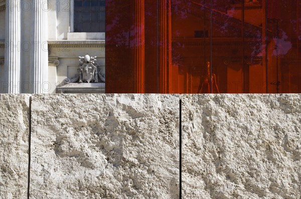 ITALY, Lazio, Rome, A red perspex cube part of a Valentino fashion exhibition behind a stone wall outside the Ara Pacis in front of the neo Classical church of San Rocco designed by Giuseppe Valadier