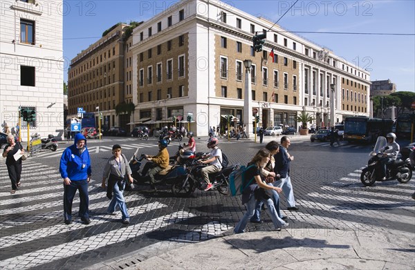 ITALY, Lazio, Rome, Pedestrian crossing with people and traffic on the Via della Conciliazione