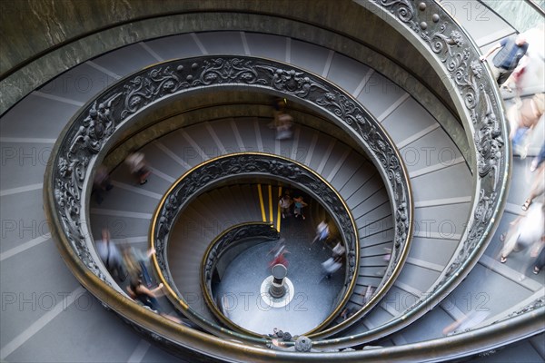 ITALY, Lazio, Rome, Vatican City Museum The Spiral Ramp by Giuseppe Momo dated 1932 with visitors walking down
