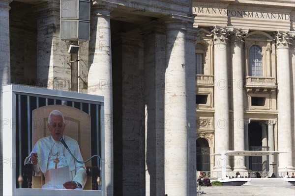 ITALY, Lazio, Rome,  Vatican City Pope Benedict XVI Joseph Alois Radzinger seen on a large video TV monitor display and seated under a canopy in St Peter's Square for the wednesday Papal Audience in front of the Basilica