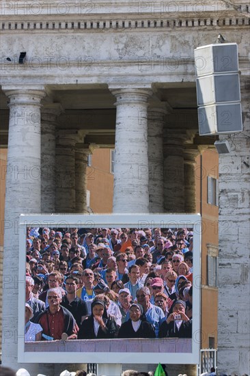 ITALY, Lazio, Rome, Vatican City Pilgrims seen on a large video TV monitor display in St Peter's Square for the wednesday Papal Audience in front of the Basilica given by Pope Benedict XVI Joseph Alois Radzinger