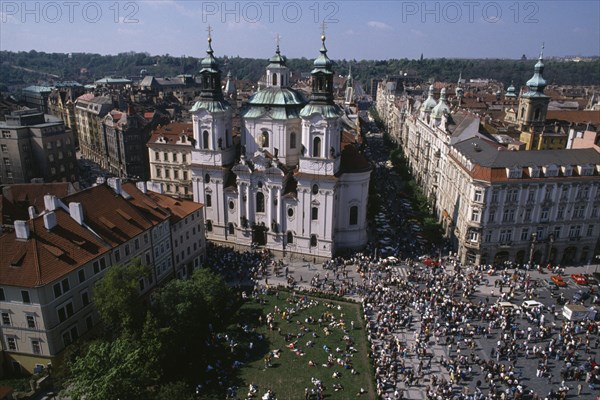 CZECH REPUBLIC, Prague, Elevated view over Old Town Square crowds and surrounding architecture.