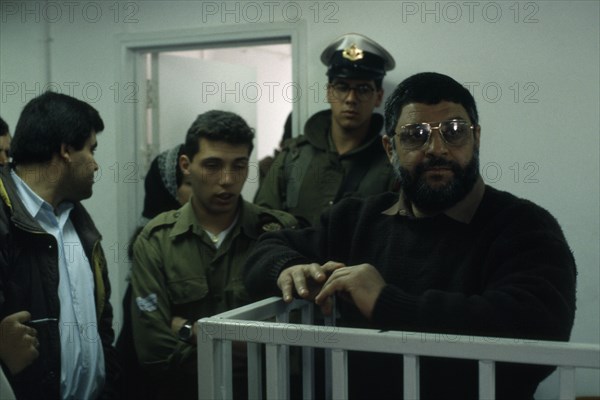 ISRAEL, Palestine , Gaza, Dr Abdel Aziz al Rantissi standing in a cage / dock inside an Israeli courthouse. The co-founder and political leader of Hamas a Palestinian militant Islamist organisation in the Gaza Strip. Assassinated in a missile attack by the Israeli Army in 2004