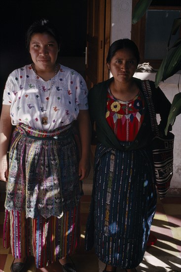 GUATEMALA, Alta Verapaz, Coban, Roman Catholic Mission. Full length standing portrait of two Quiche Indian widows who run the Conavigua Association a committee of Guatemalan Indigenous widows of men killed during the civil war.