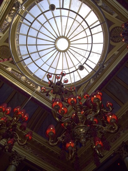 IRELAND, North, Belfast, "Interior of the Cafe Vaudeville bar and restaurant in Arthur Street. Detail of skylight and chandeliers, building used to be a Bank."