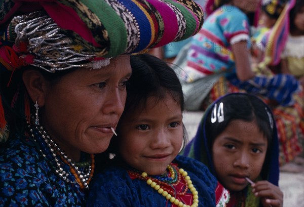 GUATEMALA, El Quiche, San Andres de Sajcabaja, Quiche Indian mother and daughter at San Andres festival