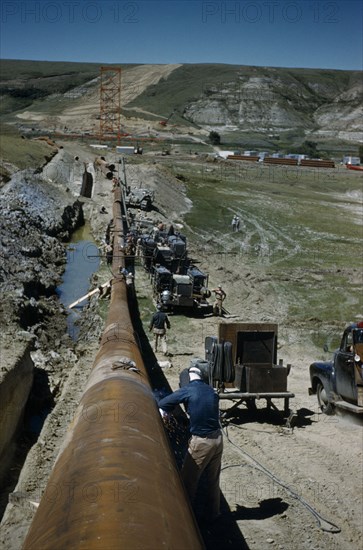 CANADA, Saskatchewan , Prairies, Constructing Trans Canada gas pipeline over Saskatchewan Prairies.