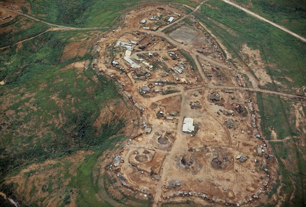 VIETNAM, Central Highlands, Dak Pek , Vietnam War. Aerial view over Dak Pek  a heavily fortified U.S. and Montagnard Special Forces camp in the Central Highlands of South Vietnam behind Viet Cong lines and Ho Chi Minh trail.