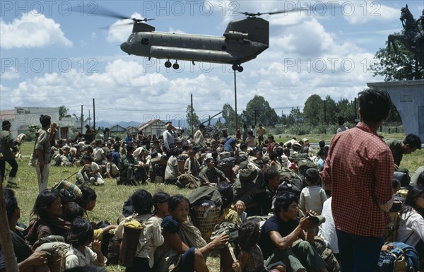 VIETNAM, Central Highlands, Kontum, Vietnam War. Montagnard refugees await shipment back to their villages outside battle zone in a US helicopter