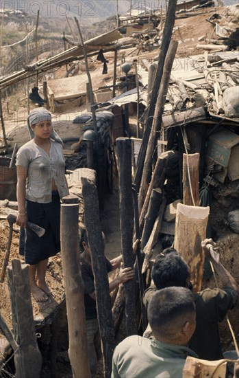 VIETNAM, Central Highlands, Dak Pek, Vietnam War. Dak Pek United States and Montagnard Special Forces defensive outpost behind Viet Cong lines in the Central Highlands of South Vietnam. Underground trenches form Montagnard living quarters with families living there for years on end.