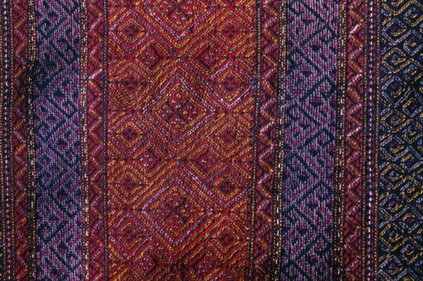 BANGLADESH, Crafts, Textiles, Detail of red and purple woven murang pinon or loin cloth.