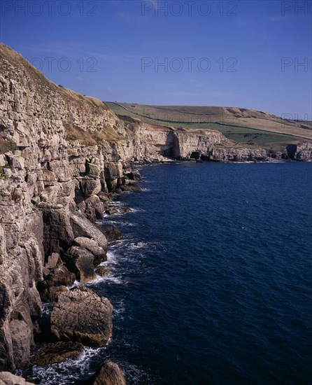 ENGLAND, Dorset, Jurassic Coastline, View east towards and beyond Seacombe Quarry from Winspit ledges