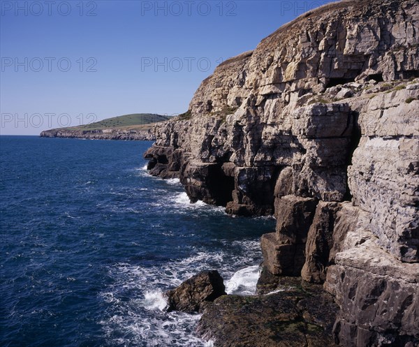 ENGLAND, Dorset, Jurassic Coastline, View west from Dancing Ledge towards Seacombe Quarry with grassy hilltop of East Man circa 107 metres  (350 feet)