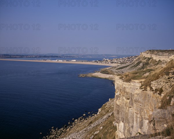 ENGLAND, Dorset, Portland, Chesil Beach viewed from quarried cliffs on north west of Isle of Portland