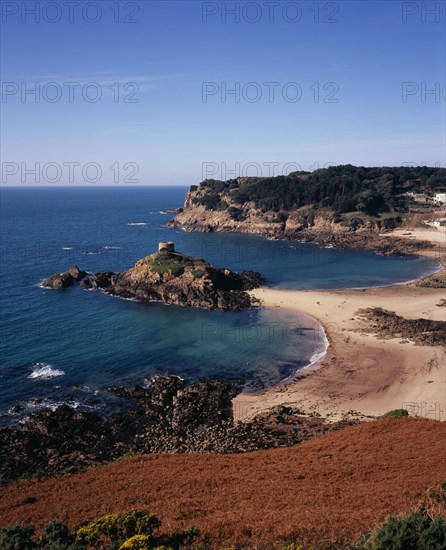 UNITED KINGDOM, Channel Islands, Jersey, St. Brelade. Portelet Bay with Isle au Guerdain a tower built on a tidal island seen in the centre