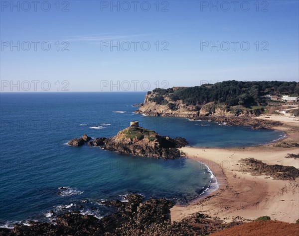 UNITED KINGDOM, Channel Islands, Jersey, St. Brelade. Portelet Bay with Isle au Guerdain a tower built on a tidal island seen in the centre