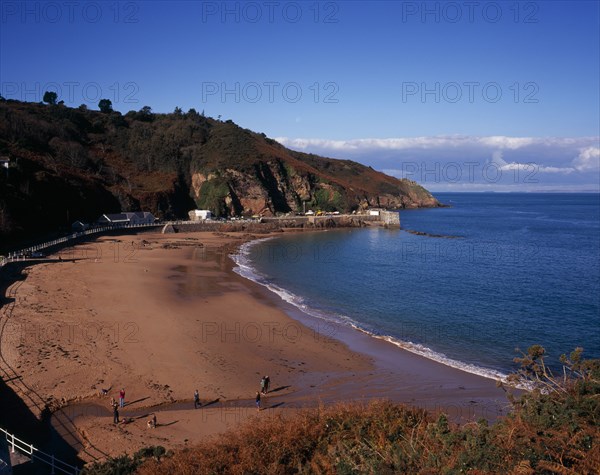 UNITED KINGDOM, Channel Islands, Jersey, St Mary’s. West view across beach at Vill of Greve de Lecq at on the north coast