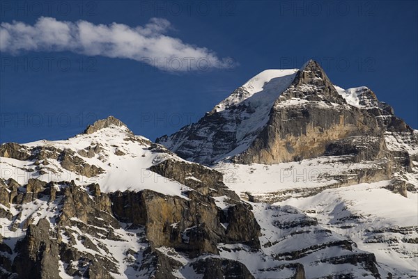 SWITZERLAND, Bernese Oberland, Murren, Summit of Monch Mountain in evening light.