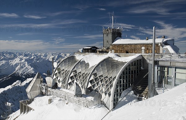 GERMANY, Bavaria, Zugspitze, Terrace viewpoint on summit of Zugspitze with various buildings.