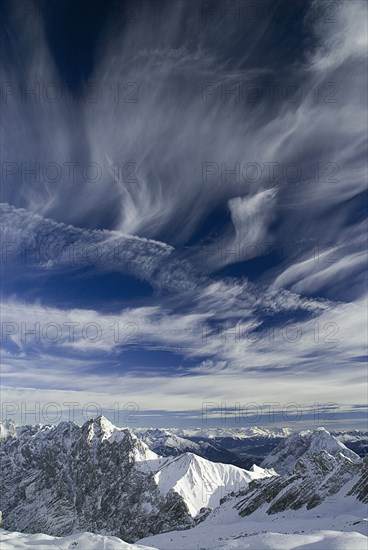 GERMANY, Bavaria, Zugspitze, Vista south from Zugspitzplatt with dramatic sky.