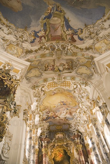GERMANY, Bavaria, Wieskirche, "Baroque church, interior view of ornamentation and frescos above main altar  "