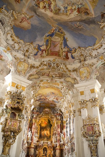 GERMANY, Bavaria, Wieskirche, "Baroque church, interior view of ornamentation and frescoes painted on ceiling above main altar and pulpit. "