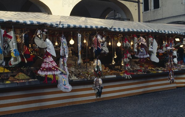 ITALY, Veneto, Padua, Puppets of New Year witch La Befana on street stall in Piazza del Erbes. La Befana is a character in Italian folklore who delivers presents to children at Epiphany.