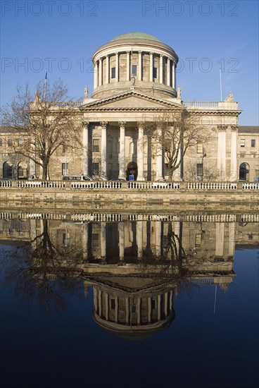 20093553 IRELAND Dublin Dublin The Four Courts building with reflection in the River Liffey. Irelands foremost dispenser of justice