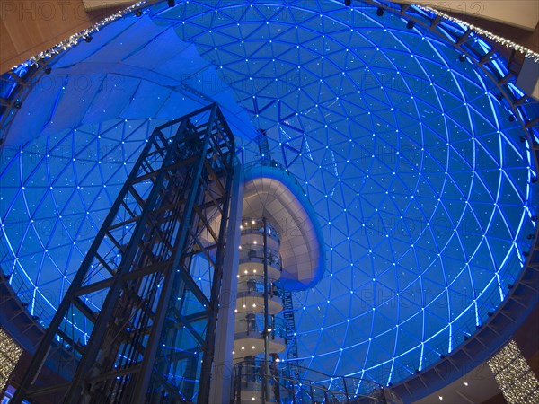 IRELAND, North, Belfast, Victoria Square shopping centre decorated for Christmas. View of the glass dome illuminated at night.