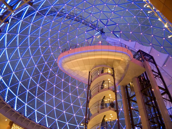 IRELAND, North, Belfast, Victoria Square shopping centre decorated for Christmas. View of the glass dome illuminated at night.