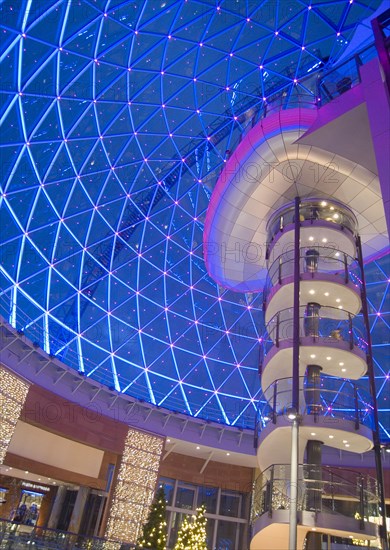 IRELAND, North, Belfast, Victoria Square shopping centre decorated for Christmas. View of the glass dome illuminated at night.