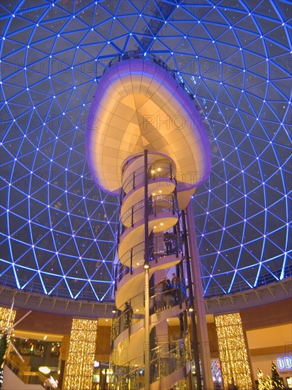 IRELAND, North, Belfast, Victoria Square shopping centre decorated for Christmas. View of the glass dome illuminated at night.