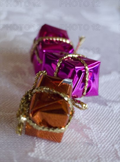 FESTIVALS, Religious, Christmas, Minature wrapped Christmas presents used as festive dinner table decorations.