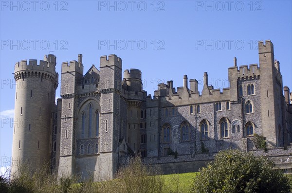 ENGLAND, West Sussex, Arundel, View of the castle from the river bank.