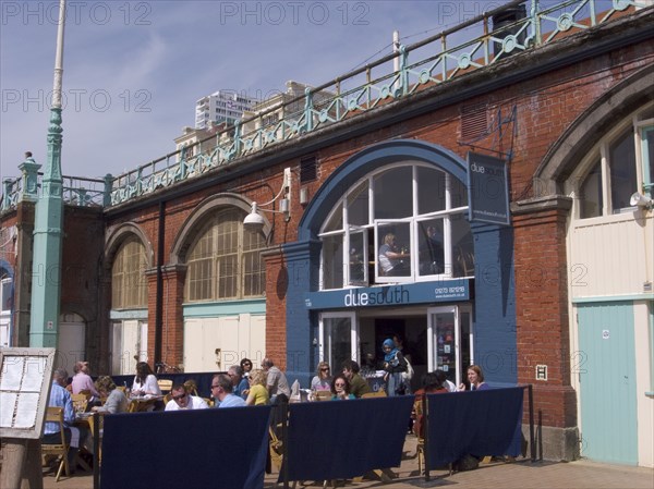 ENGLAND, East Sussex, Brighton, Due South restaurant in the arches underneath the promenade.