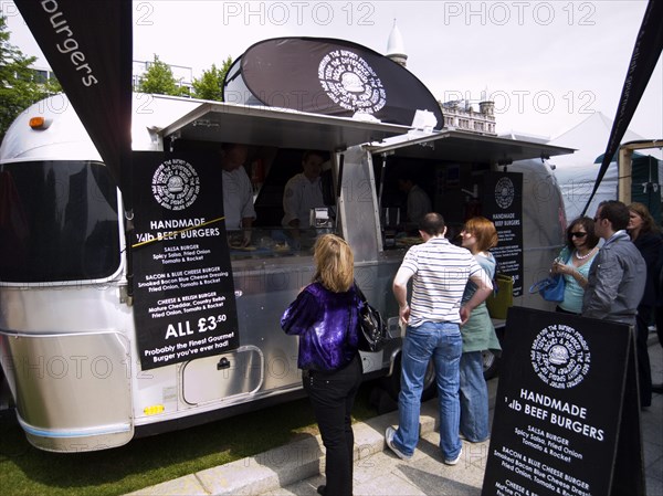 IRELAND, North, Belfast, Airstream trailer used as fast food outlet at food fair in the grounds of the City Hall.