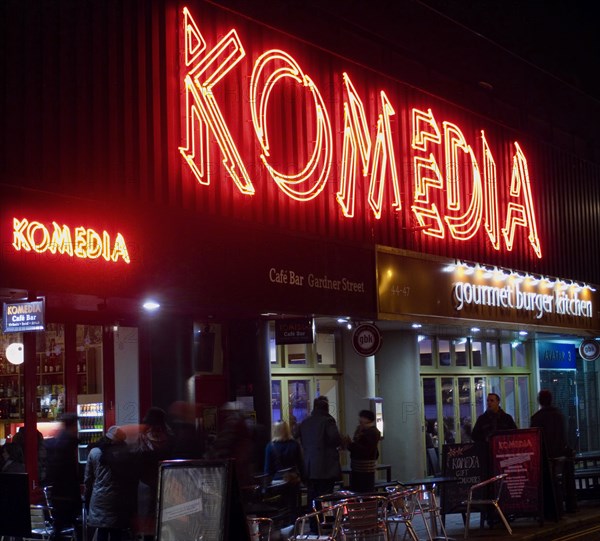 ENGLAND, East Sussex, Brighton, "Exterior of the Komedia theatre, cafe and bar in Gardner Street. Neon Sign"