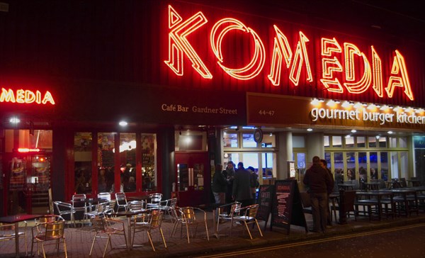 ENGLAND, East Sussex, Brighton, "Exterior of the Komedia theatre, cafe and bar in Gardner Street. Neon Sign"