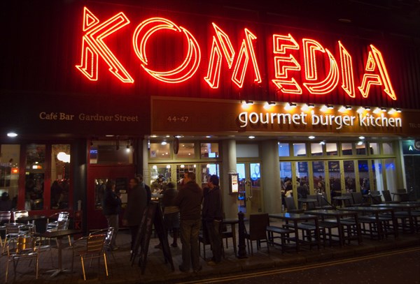 ENGLAND, East Sussex, Brighton, "Exterior of the Komedia theatre, cafe and bar in Gardner Street. Neon Sign"