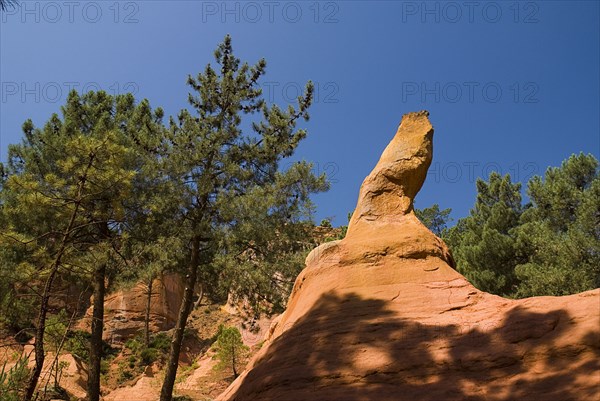 FRANCE, Provence Cote d’Azur, Le Sentier des Ocres (The Ochre Footpath) , "Jagged, eroded outcrop of red rock in the area known as the Holm Oak Valley."